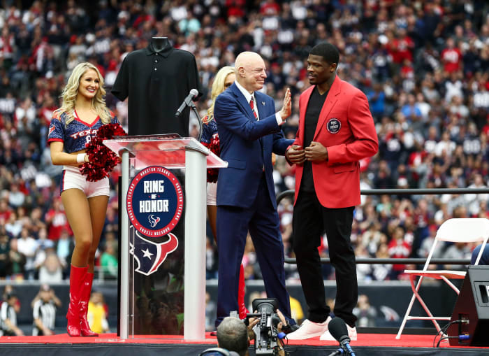 Former Texans wide receiver Andre Johnson (right) is inducted into the team's Ring of Honor by owner Bob McNair at halftime of a 2017 game against the Cardinals.